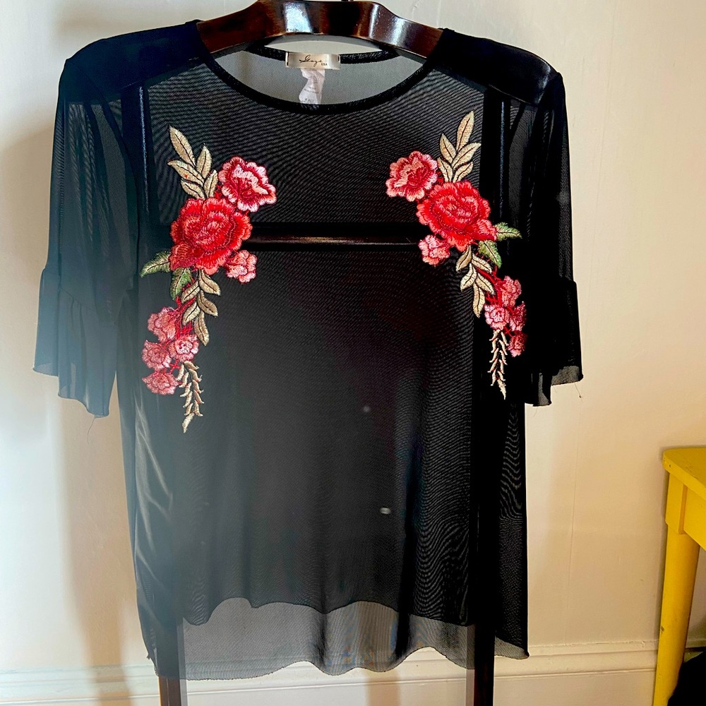 Sheer black top with embroidered detail
